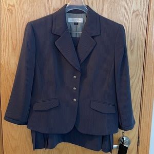 Blue skirt suit with white pinstripe.